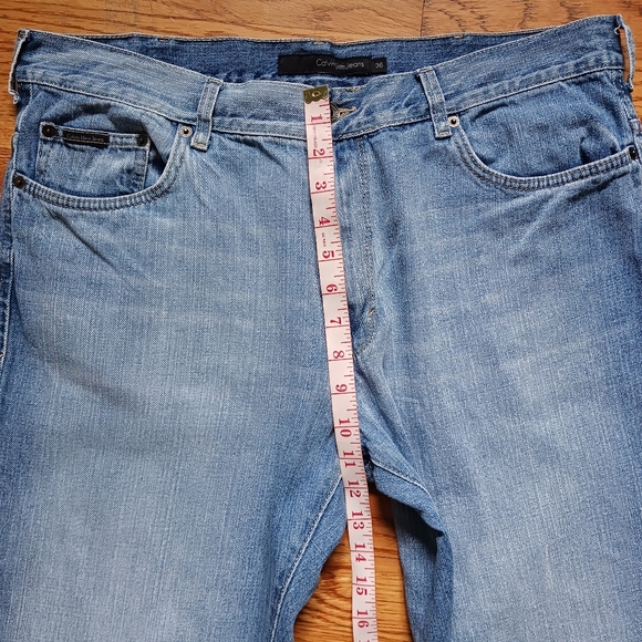 Calvin Klein • Men's Light/Medium Wash Distressed Bootcut Denim Jeans - Picture 13 of 15